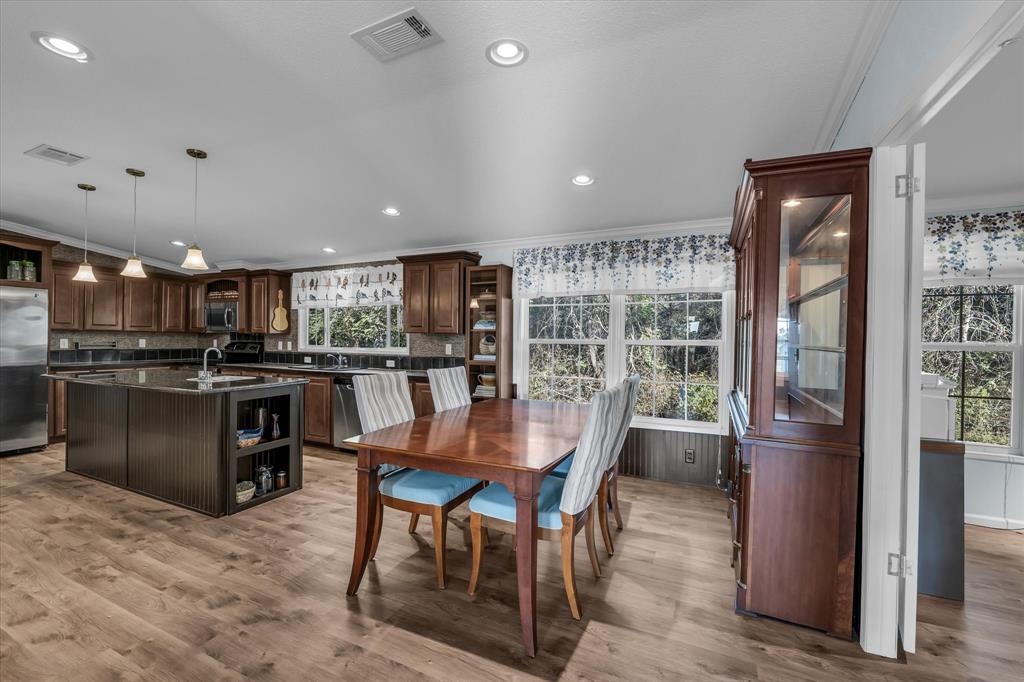 1745 Meixner Road Waco, TX 76705 - Photo 16 of 40 a kitchen with a table and chairs in it