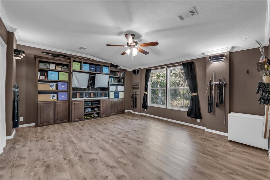 1745 Meixner Road Waco, TX 76705 - Photo 18 of 40 a kitchen with stainless steel appliances kitchen island granite countertop a refrigerator and a stove top oven