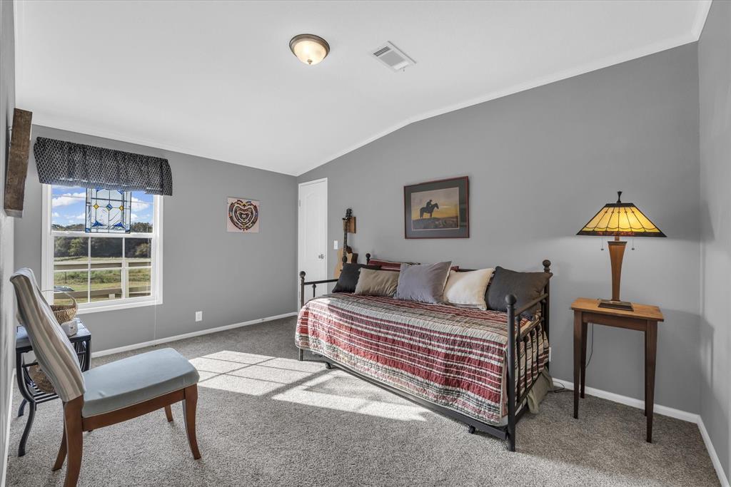 1745 Meixner Road Waco, TX 76705 - Photo 20 of 40 a bedroom with a bed and a window