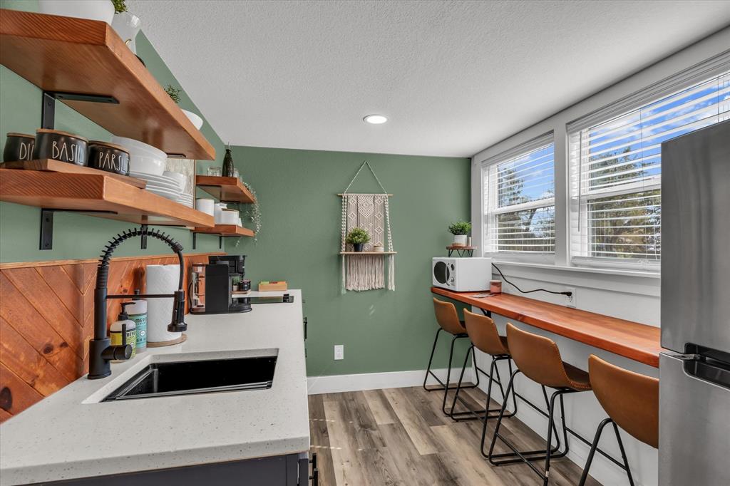 1745 Meixner Road Waco, TX 76705 - Photo 32 of 40 a living room with furniture and a wooden floor