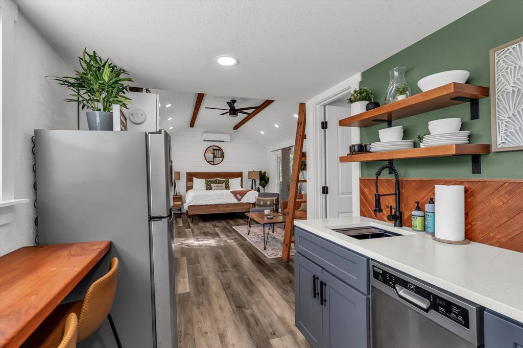 1745 Meixner Road Waco, TX 76705 - Photo 33 of 40 a room with furniture and a wooden floor