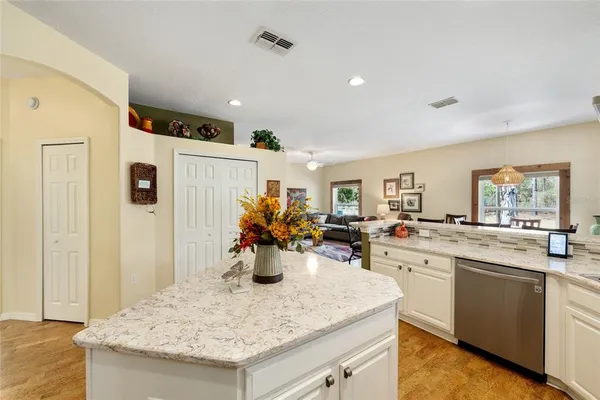 a kitchen with a sink and refrigerator
