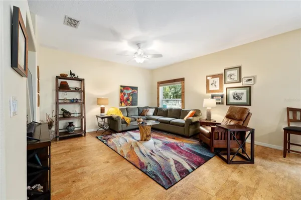a living room with furniture or couch and a bookshelf