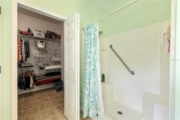 a bathroom with a shower and a sink