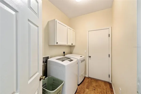 a utility room with sink dryer and washer