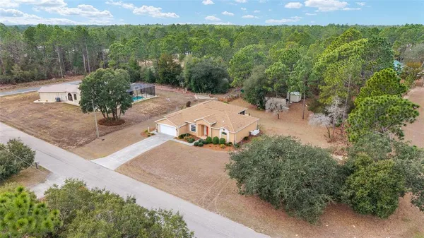 a view of a backyard of a house with a yard