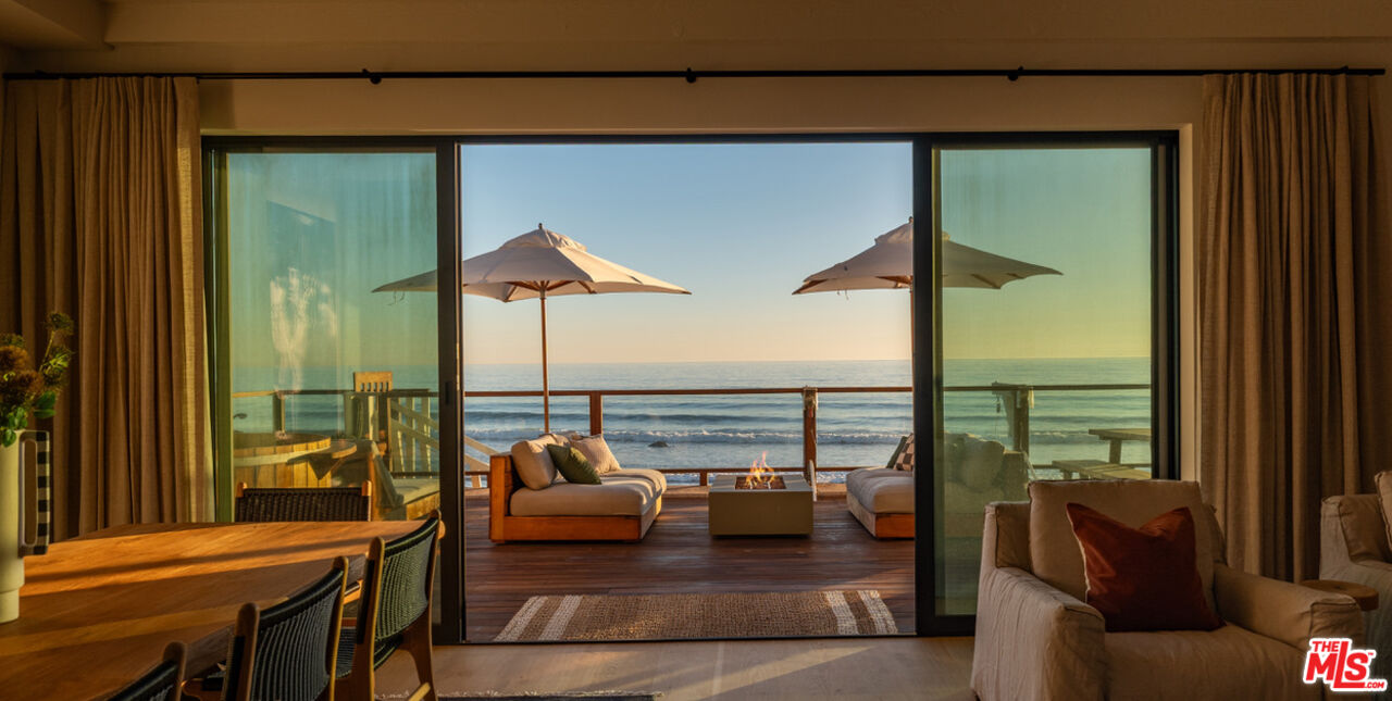 31376 Broad Beach Road Malibu, CA 90265 - Photo 6 of 32 a balcony with furniture and a table