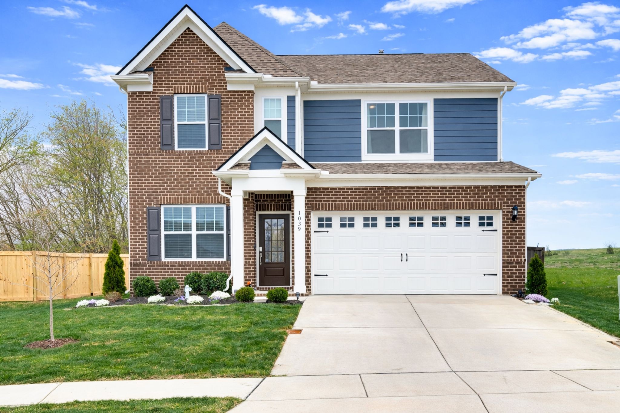 1039 Ewell Farm Drive Spring Hill, TN 37174 - Photo 1 of 70 a front view of a house with a yard