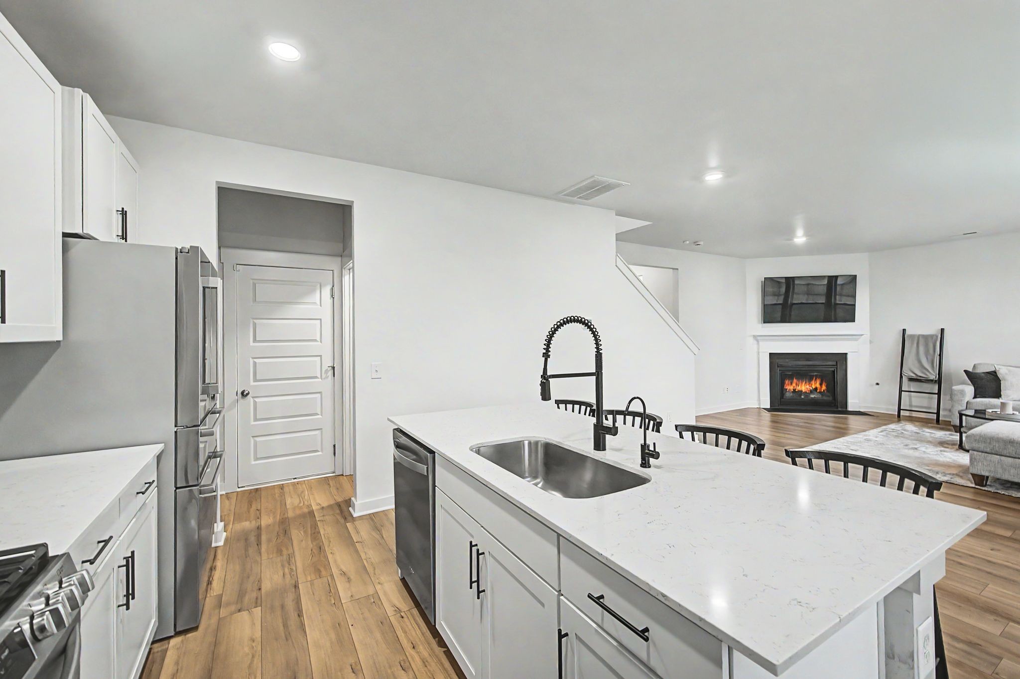 1039 Ewell Farm Drive Spring Hill, TN 37174 - Photo 25 of 70 a kitchen with stainless steel appliances a sink stove and refrigerator