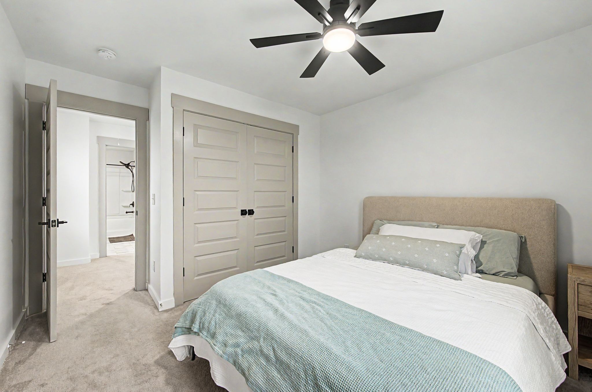 1039 Ewell Farm Drive Spring Hill, TN 37174 - Photo 33 of 70 a bedroom with a bed and a chandelier