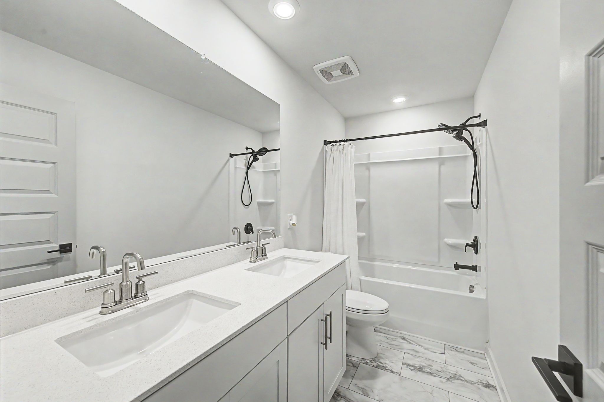 1039 Ewell Farm Drive Spring Hill, TN 37174 - Photo 34 of 70 a bathroom with a sink double vanity granite toilet tub and shower