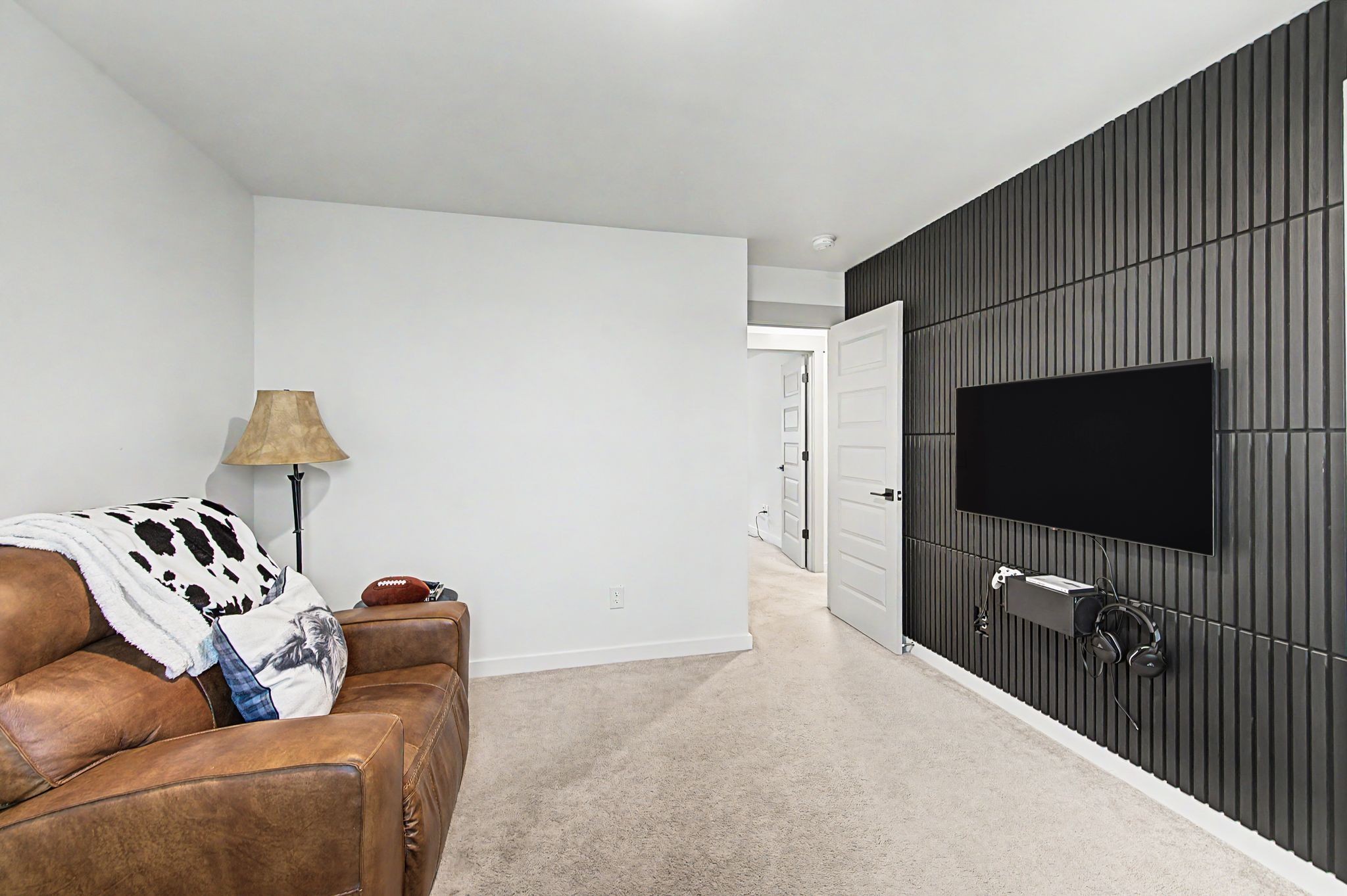 1039 Ewell Farm Drive Spring Hill, TN 37174 - Photo 37 of 70 a living room with furniture and a flat screen tv