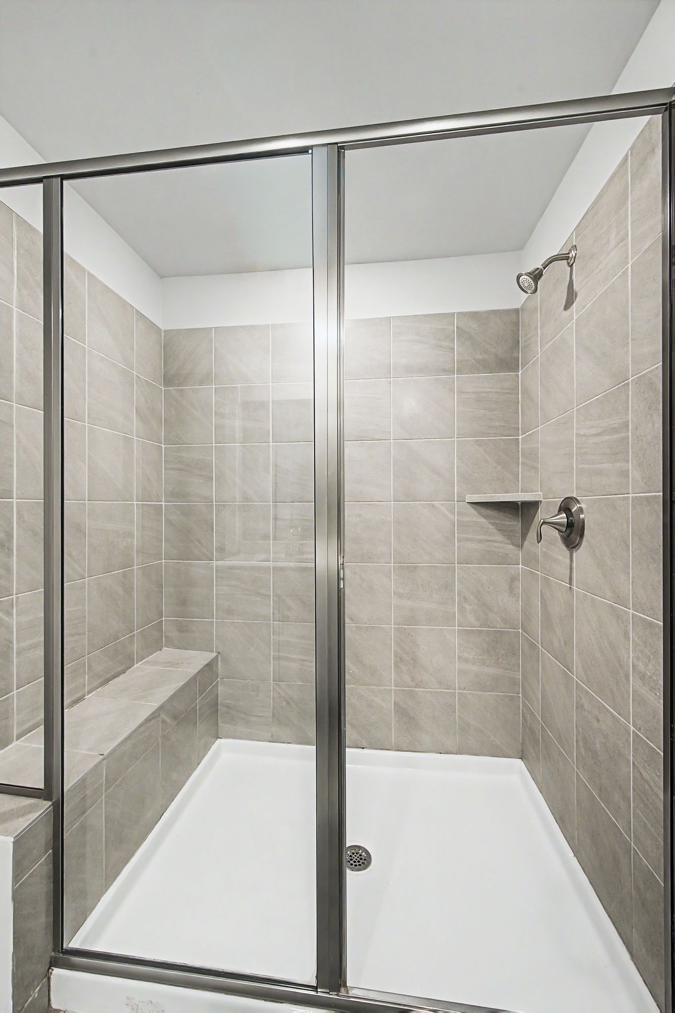 1039 Ewell Farm Drive Spring Hill, TN 37174 - Photo 42 of 70 a bathroom with a shower and a bath tub