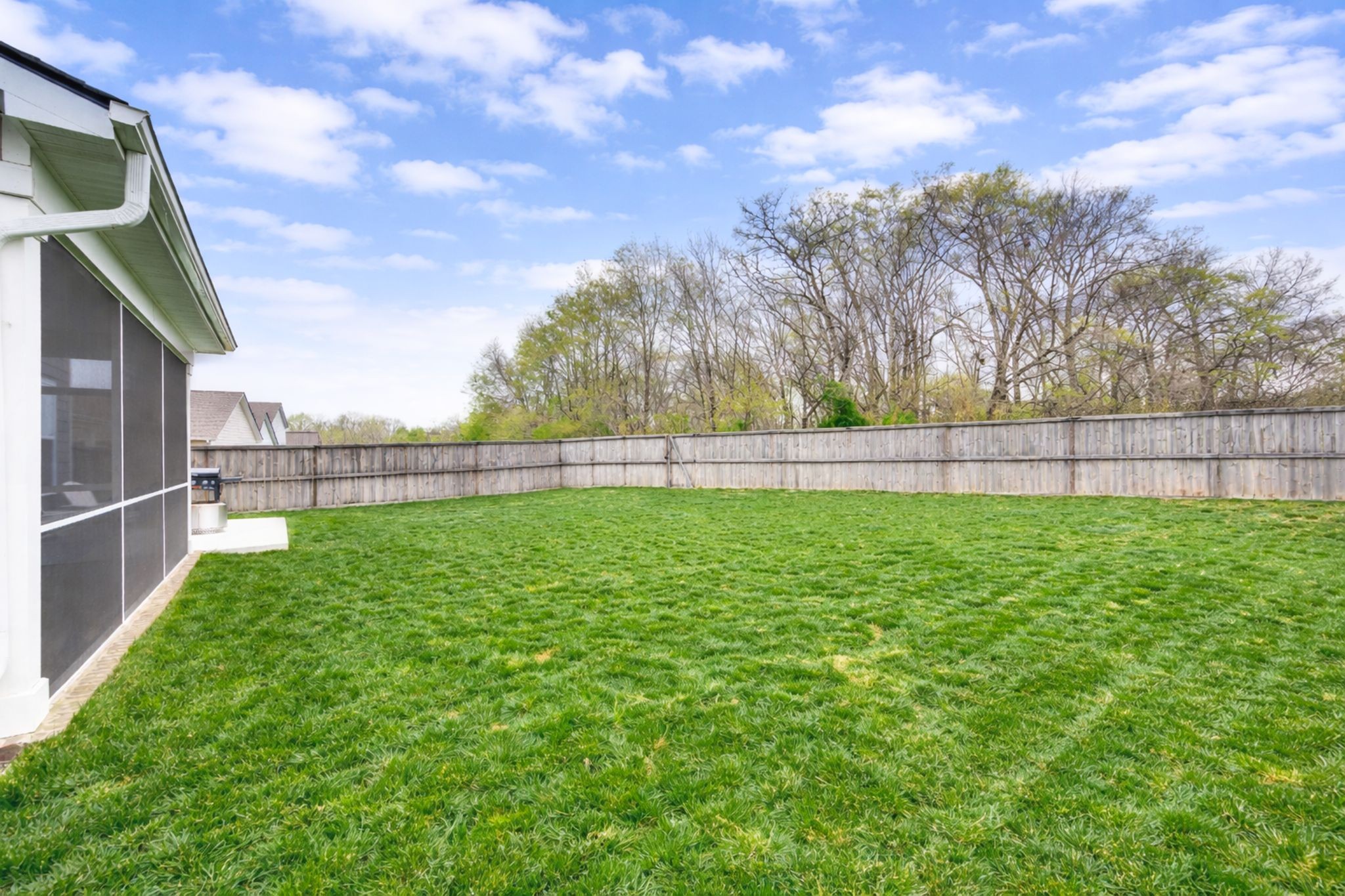 1039 Ewell Farm Drive Spring Hill, TN 37174 - Photo 49 of 70 a view of yard with grass and wooden fence