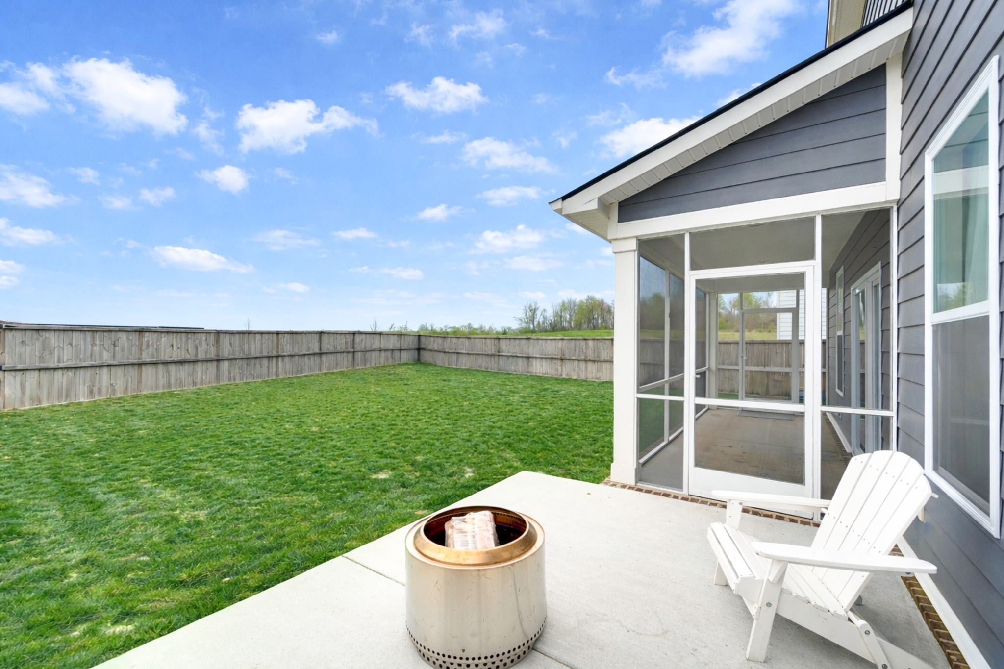 1039 Ewell Farm Drive Spring Hill, TN 37174 - Photo 8 of 70 a view of a backyard with table and chairs and potted plants