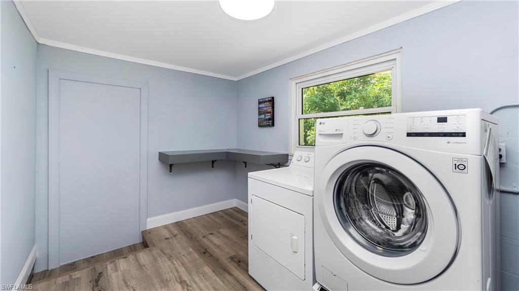 54 Hilo Court, Unit 54 Naples, FL 34112 - Photo 25 of 42 a utility room with dryer and washer
