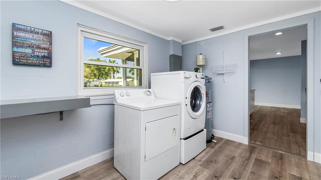 54 Hilo Court, Unit 54 Naples, FL 34112 - Photo 26 of 42 a utility room with dryer and washer