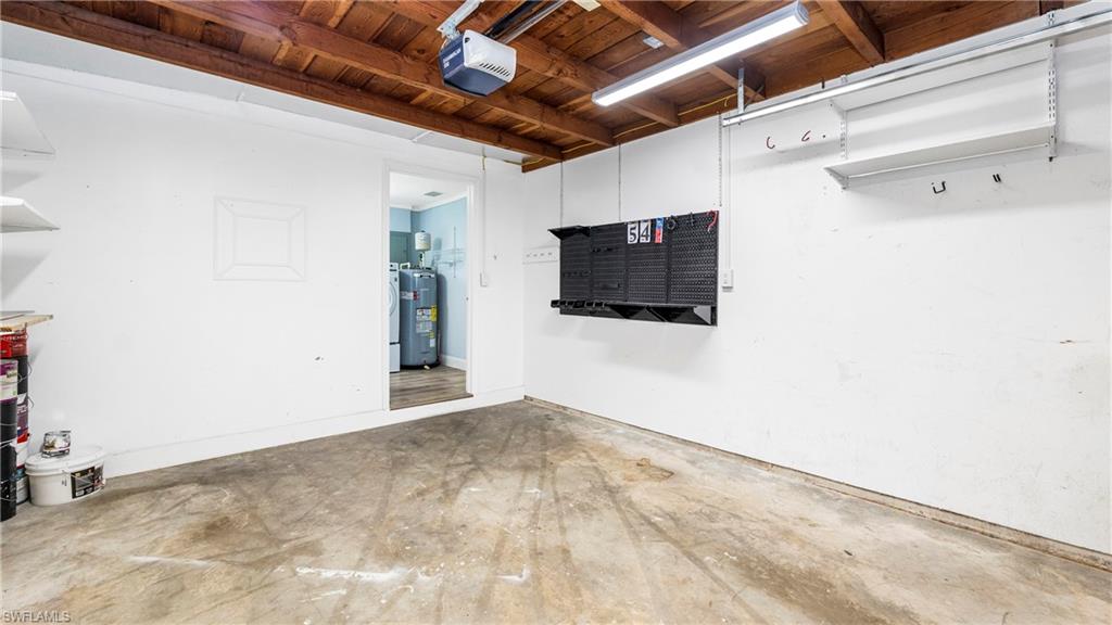 54 Hilo Court, Unit 54 Naples, FL 34112 - Photo 27 of 42 a view of empty room with wooden floor and windows