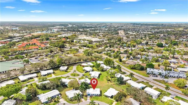an aerial view of residential houses with outdoor space