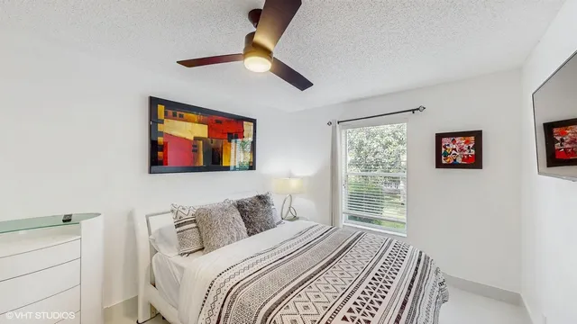 a bedroom with bed and a window