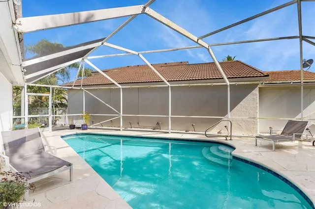 a view of a backyard with table and chairs