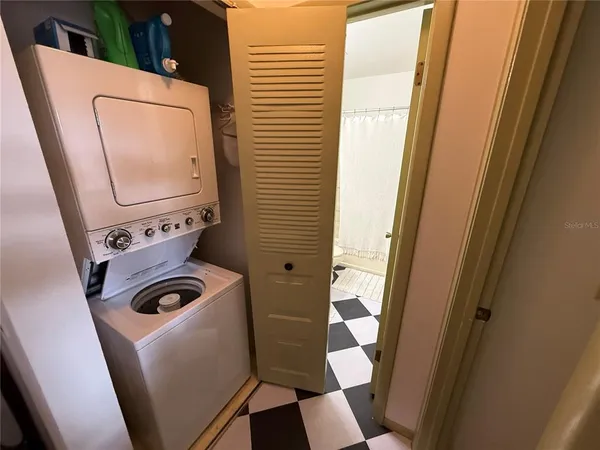 a bathroom with a sink and mirror with toilet