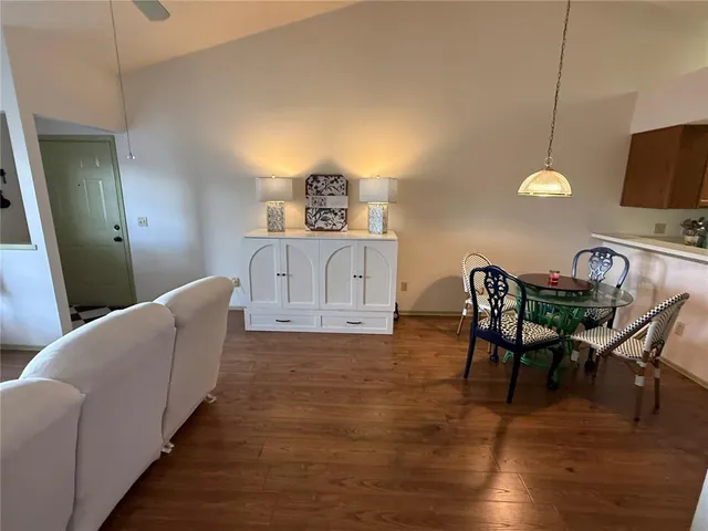 a living room with furniture fireplace and a window