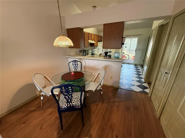 a view of a dining room with furniture window and wooden floor