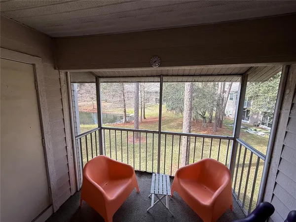 a view of a chair in wooden floor