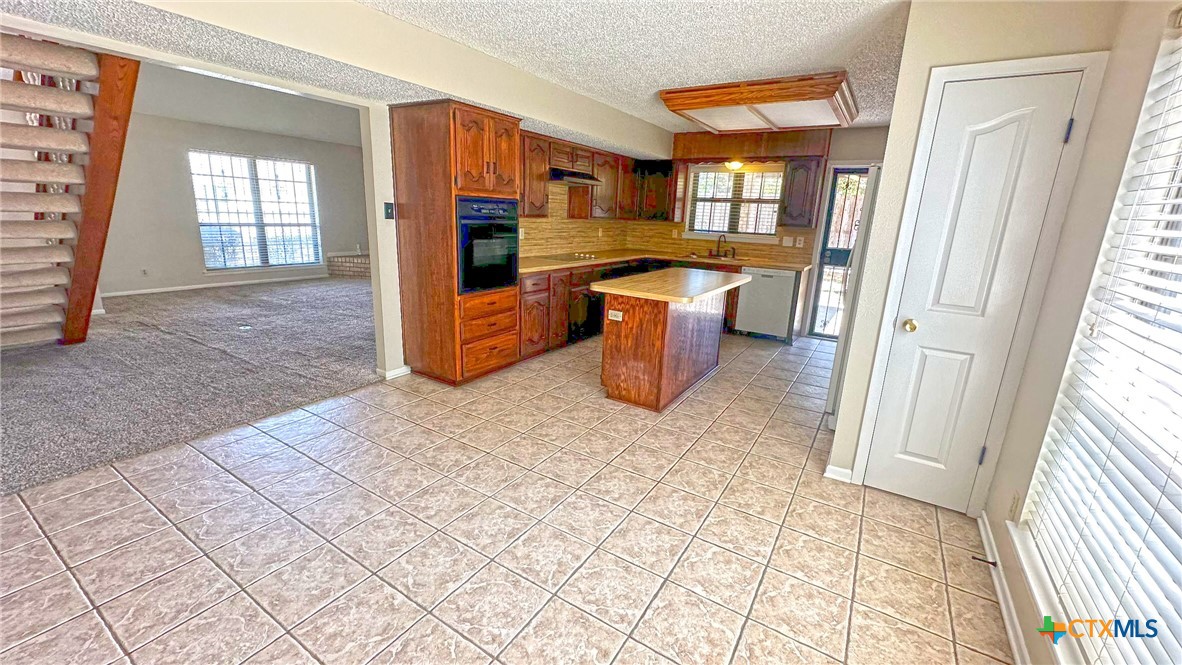 1500 Halbert Street Killeen, TX 76541 - Photo 12 of 36 a view of a kitchen with a sink and a window