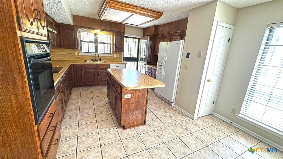 1500 Halbert Street Killeen, TX 76541 - Photo 14 of 36 a view of a kitchen with furniture and a window