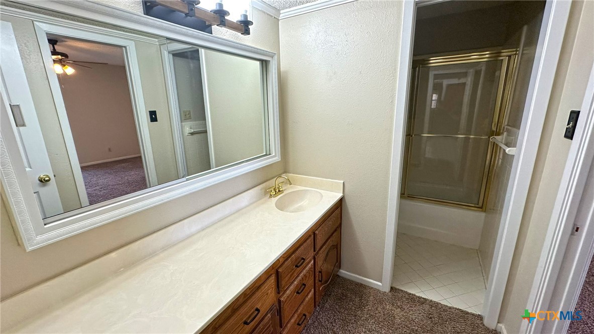 1500 Halbert Street Killeen, TX 76541 - Photo 21 of 36 a bathroom with a double vanity sink and a mirror
