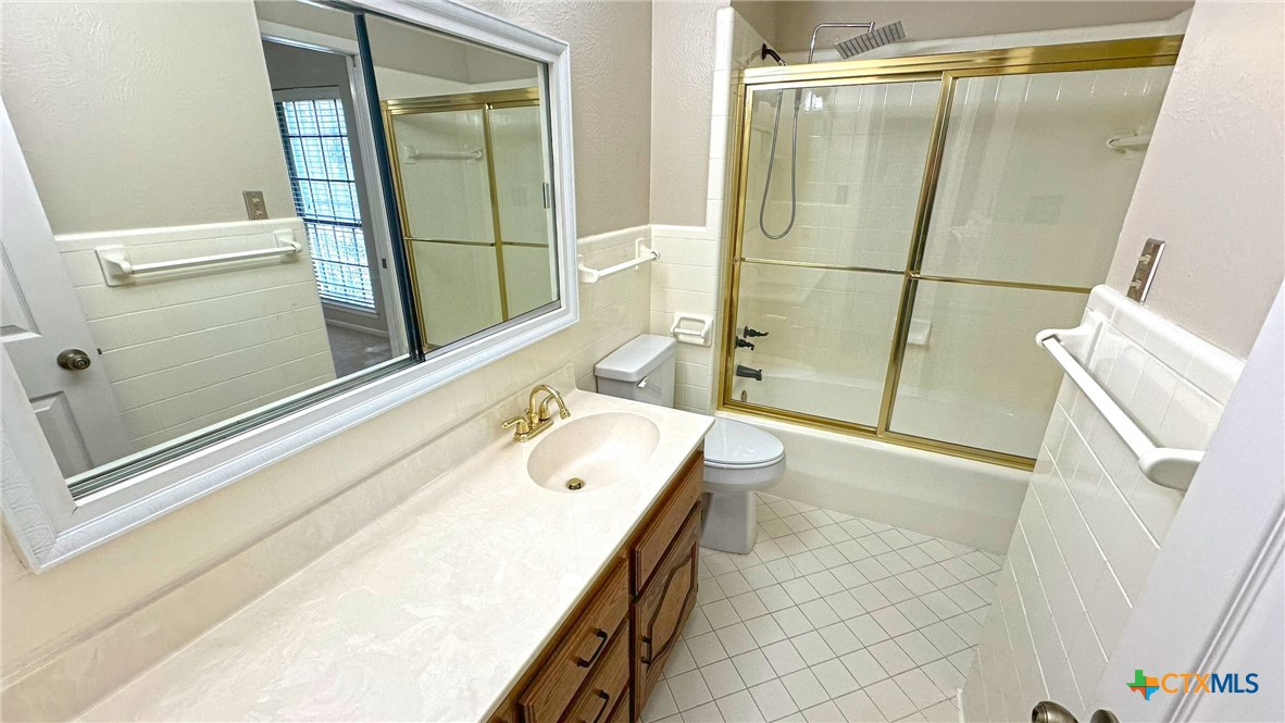 1500 Halbert Street Killeen, TX 76541 - Photo 27 of 36 a bathroom with a granite countertop sink a mirror and shower