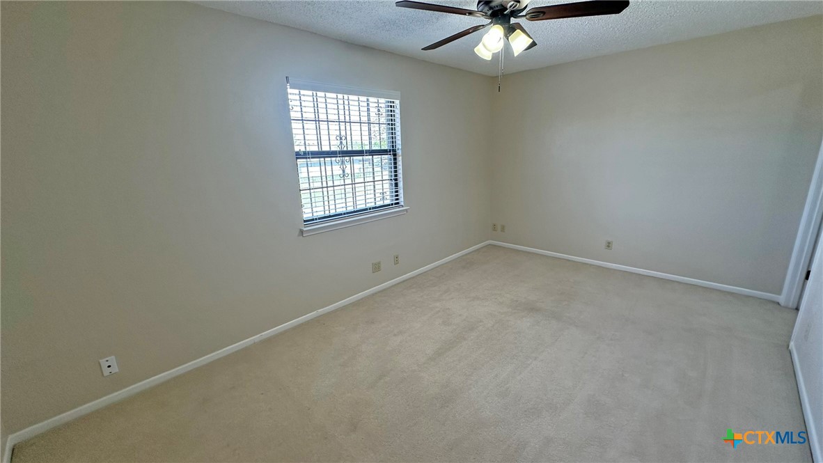 1500 Halbert Street Killeen, TX 76541 - Photo 28 of 36 an empty room with a window and a fan