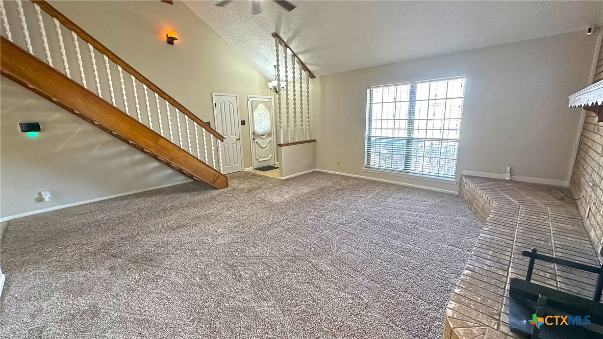 1500 Halbert Street Killeen, TX 76541 - Photo 10 of 36 a view of an empty room with stairs and a window