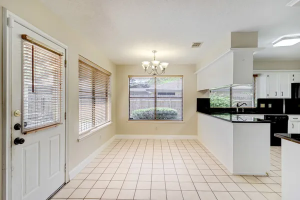a view of a kitchen with electric appliances
