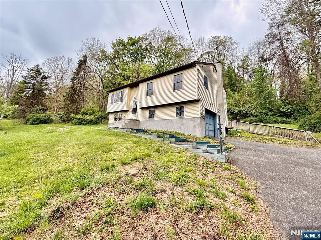 154 Cork Hill Road Franklin, NJ 07416 - Photo 1 of 35 a view of a house with a yard