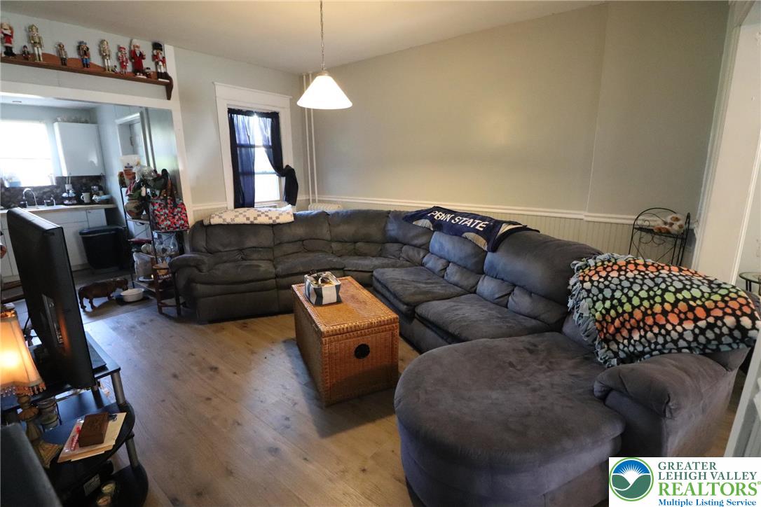 441 Franklin Avenue Palmerton, PA 18071 - Photo 11 of 31 a living room with furniture and a chandelier