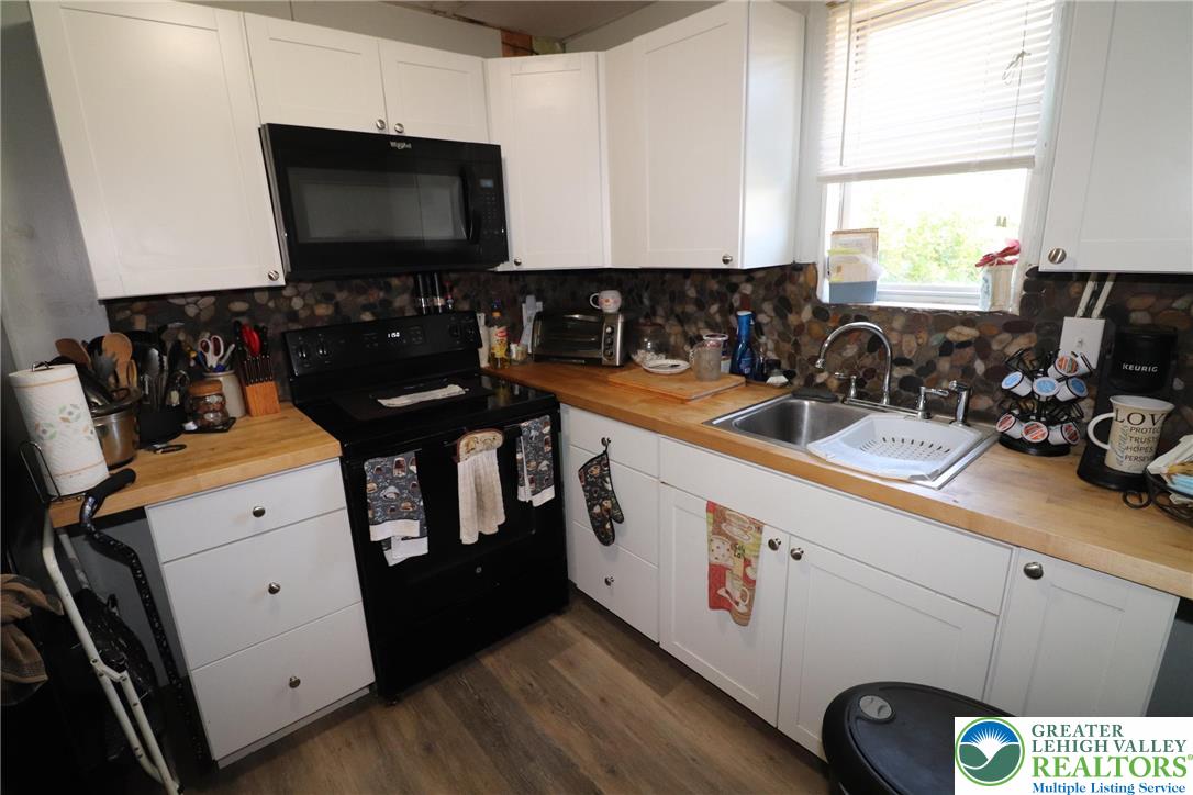 441 Franklin Avenue Palmerton, PA 18071 - Photo 13 of 31 a kitchen with a sink and a stove top oven