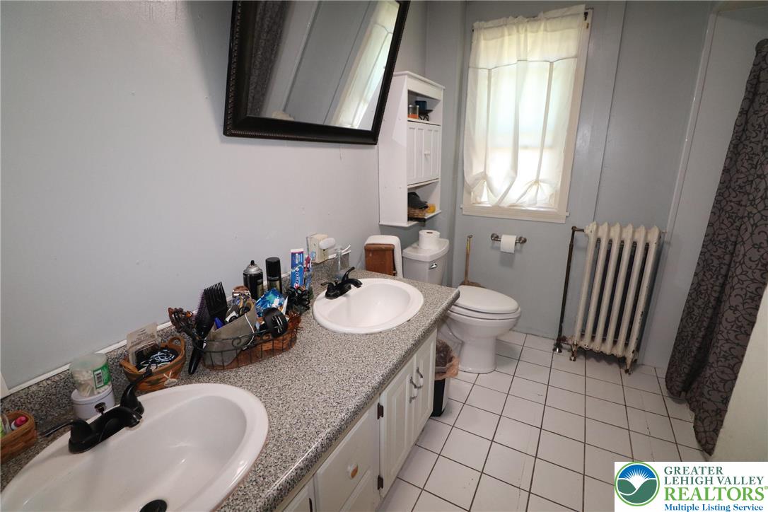 441 Franklin Avenue Palmerton, PA 18071 - Photo 15 of 31 a bathroom with a sink toilet and mirror