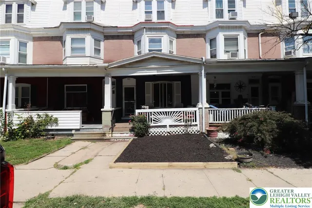 a front view of a house with yard
