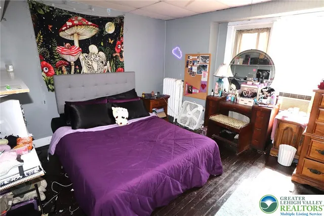 a bed room with a bed and a fireplace