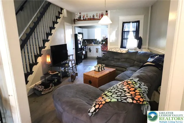 a living room with furniture and a window
