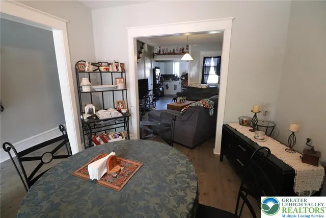 a bedroom with furniture and a book shelf