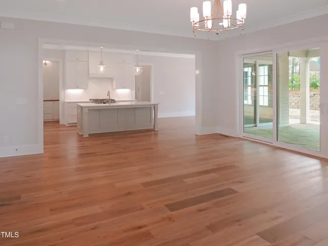 a kitchen with kitchen island a sink stainless steel appliances and cabinets