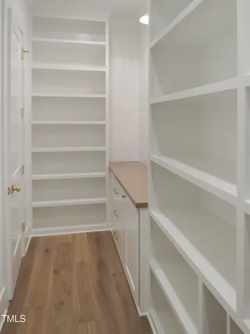 a view of storage and utility room with empty racks