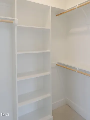 a view of an empty walk in closet