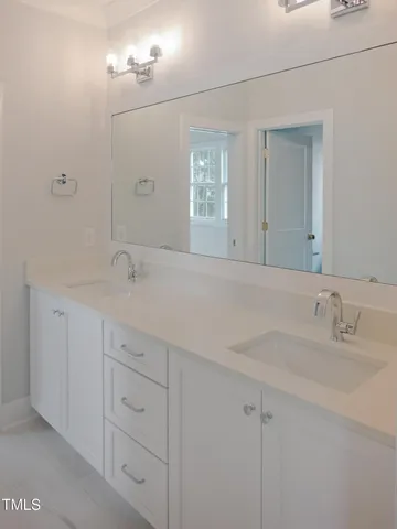 a view of a room with window and a ceiling fan in it