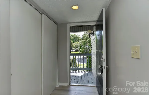 a view of an entryway with wooden floor