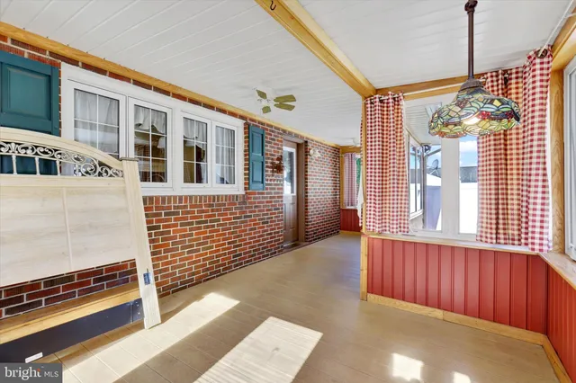 a view of a house with stairs and wooden floor
